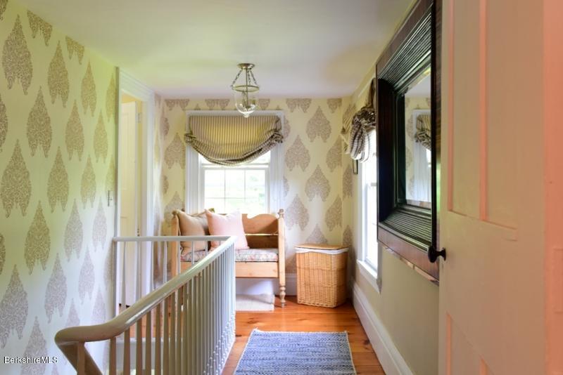 2922 State Road Richmond, MA 01254 - Photo 25 of 36 a view of a hallway with wooden floor and staircase