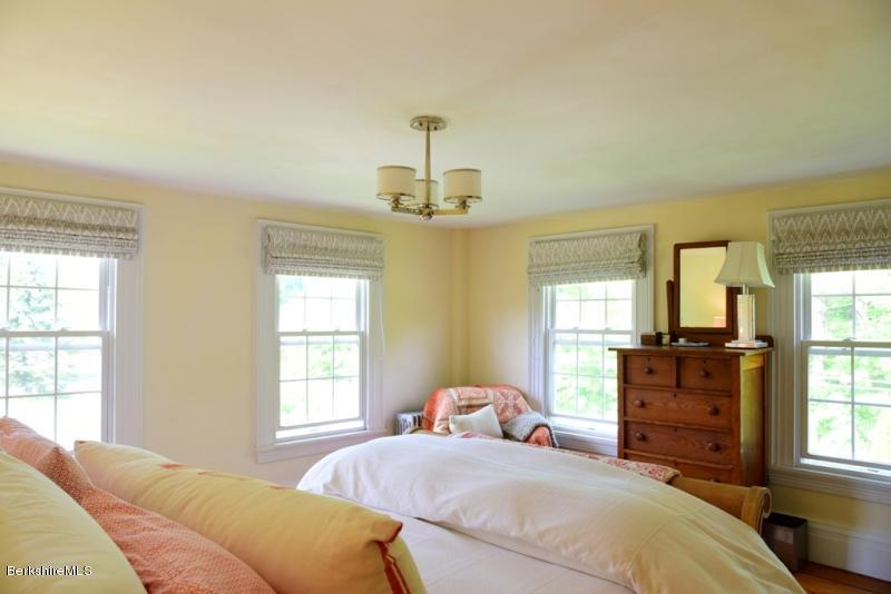 2922 State Road Richmond, MA 01254 - Photo 28 of 36 a bedroom with a bed and wooden floor