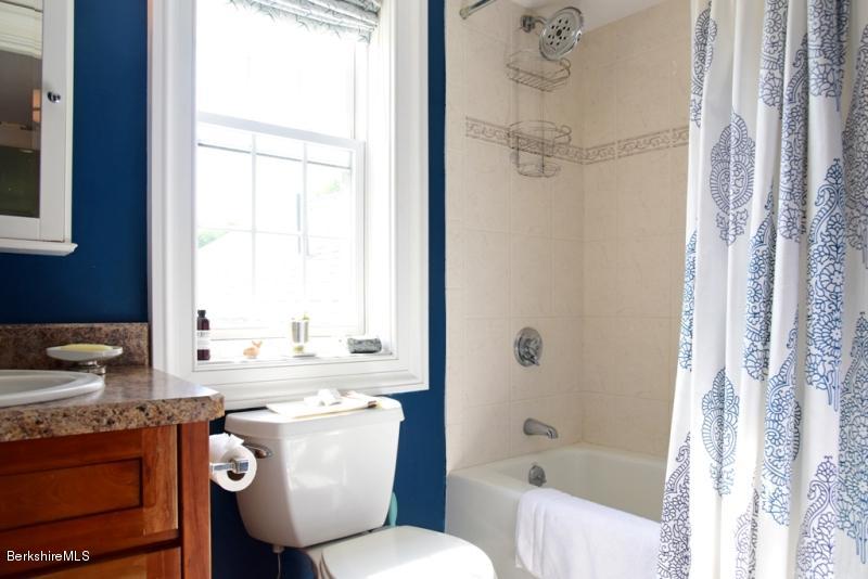 2922 State Road Richmond, MA 01254 - Photo 29 of 36 a bathroom with a granite countertop sink mirror toilet and bathtub
