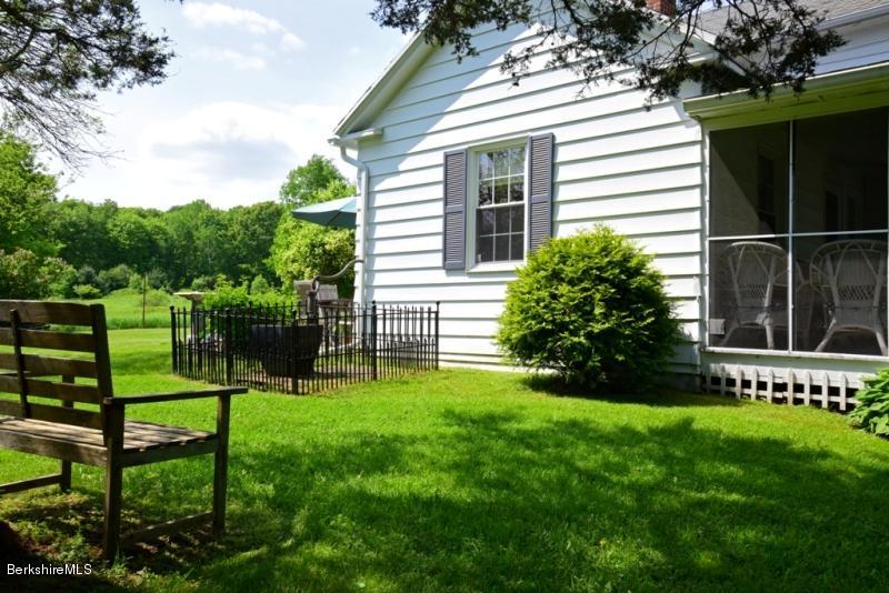 2922 State Road Richmond, MA 01254 - Photo 33 of 36 a view of a chair and table in the garden