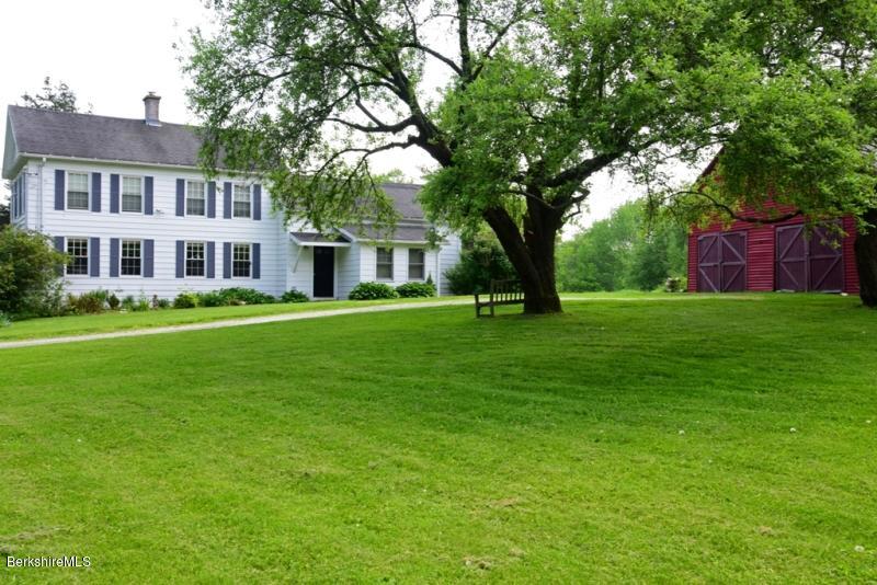 2922 State Road Richmond, MA 01254 - Photo 5 of 36 a front view of a house with a garden