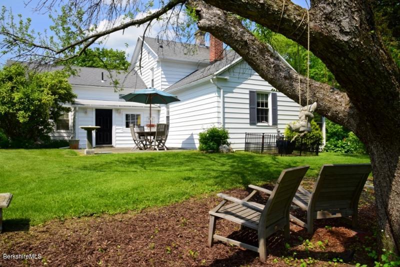 2922 State Road Richmond, MA 01254 - Photo 6 of 36 a view of a chair and table in the garden