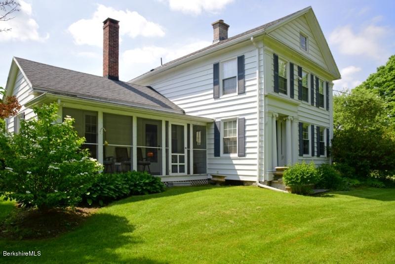 2922 State Road Richmond, MA 01254 - Photo 9 of 36 a front view of a house with a garden and plants