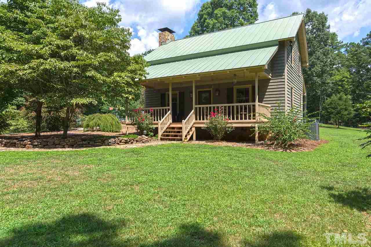 8500 McKee Road Rougemont, NC 27572 - Photo 1 of 25 a front view of house with yard and green space