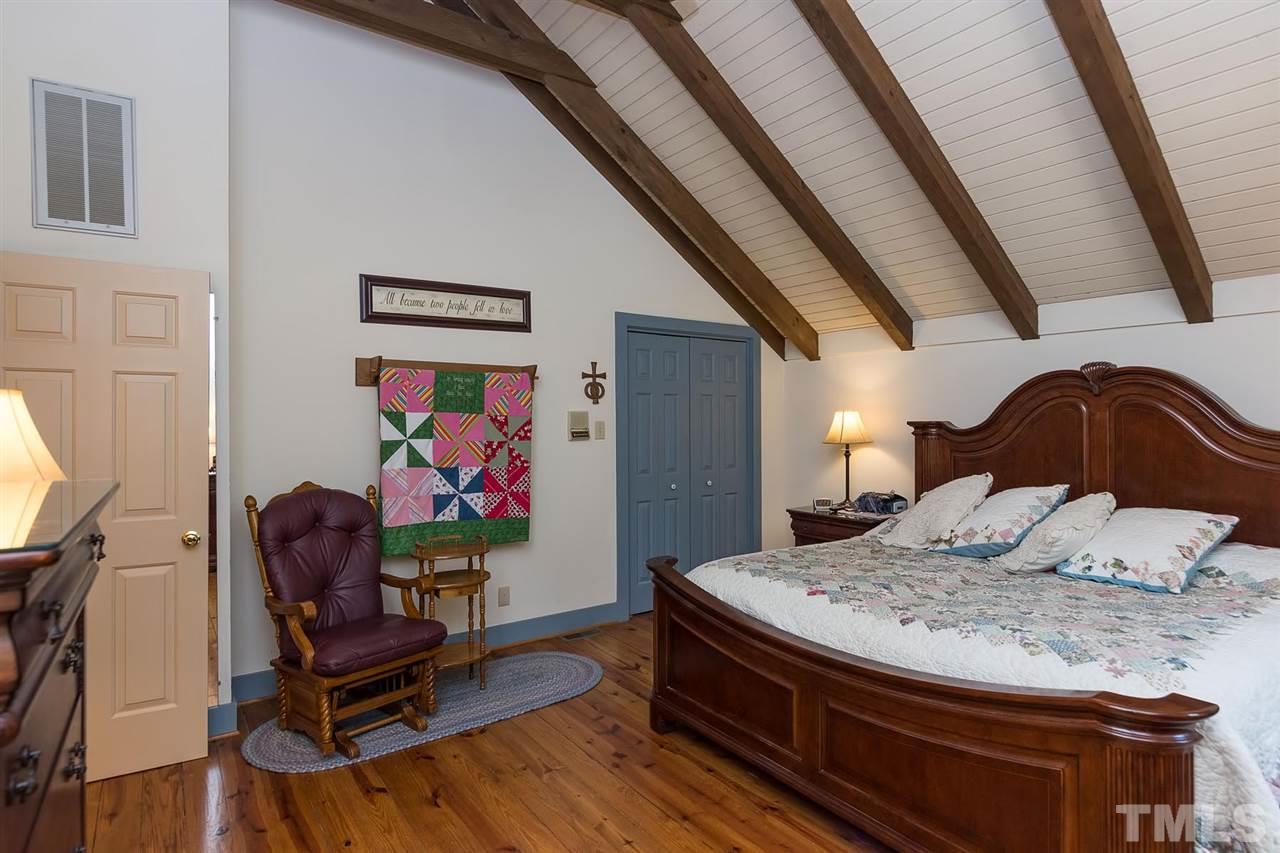 8500 McKee Road Rougemont, NC 27572 - Photo 14 of 25 a bedroom with furniture and a bed