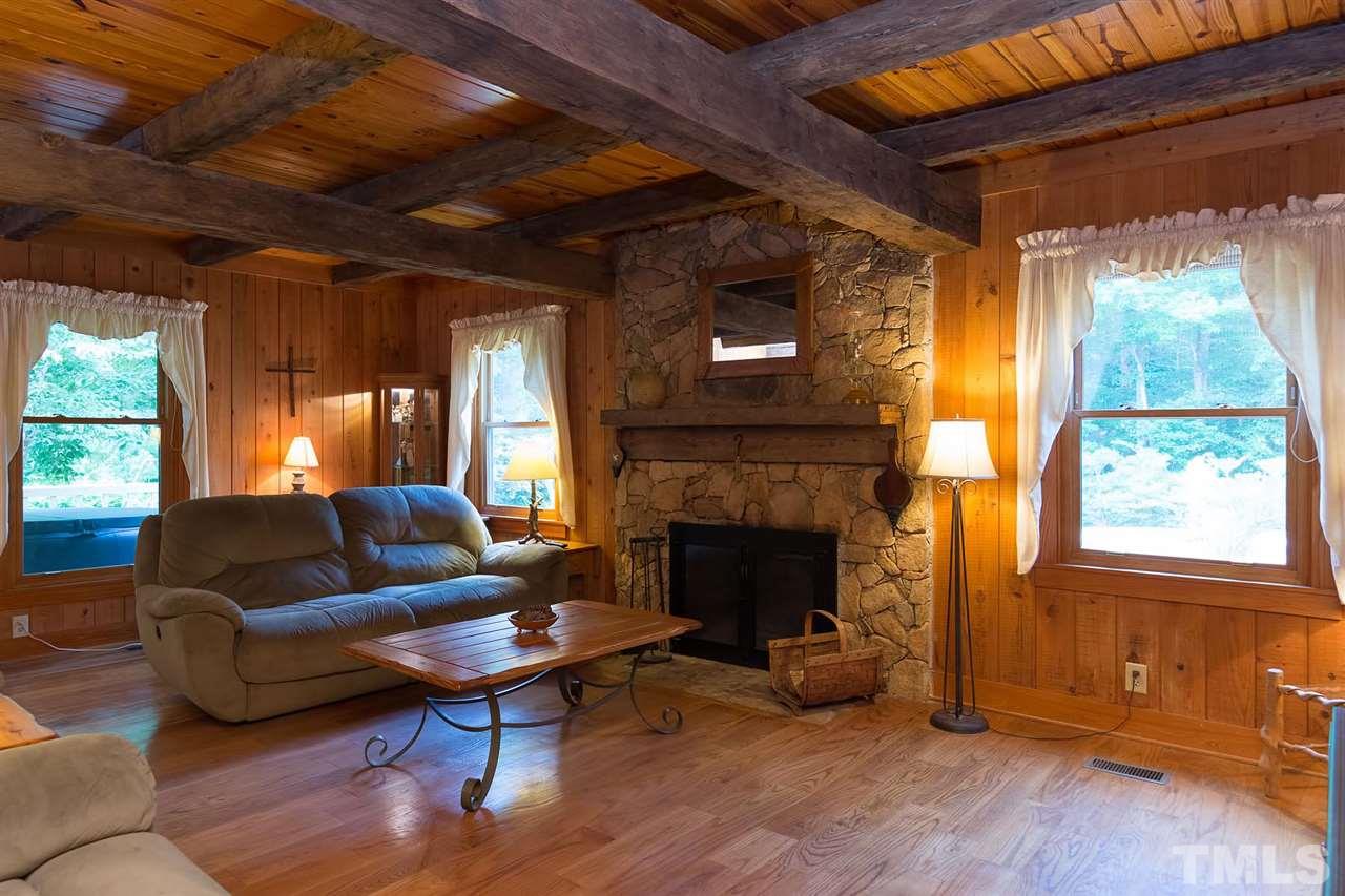 8500 McKee Road Rougemont, NC 27572 - Photo 6 of 25 a living room with furniture and a fireplace