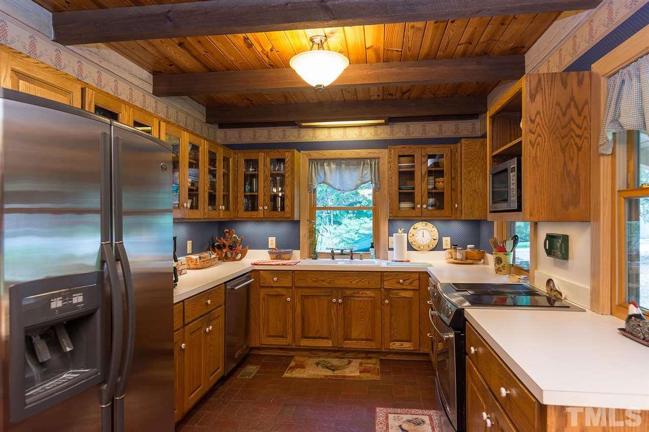 8500 McKee Road Rougemont, NC 27572 - Photo 8 of 25 a kitchen with a sink a stove and cabinets
