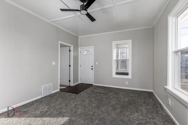 a view of an empty room with a window