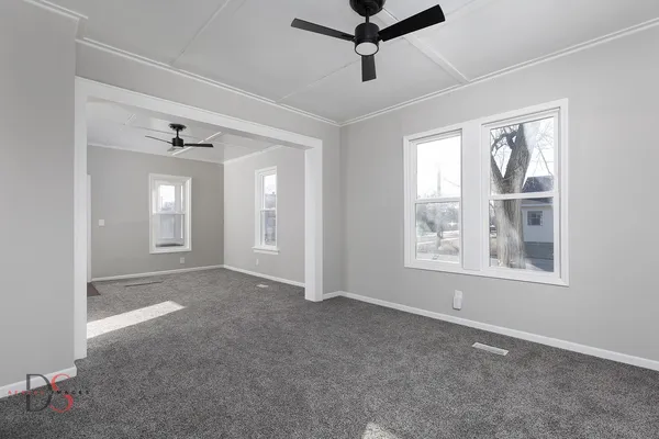 a view of an empty room with a window