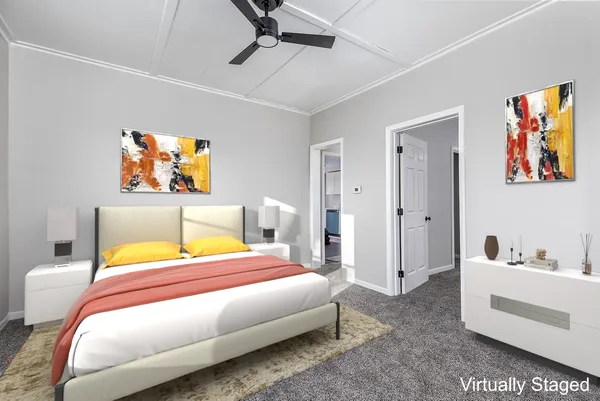 a bedroom with a bed and ceiling fan