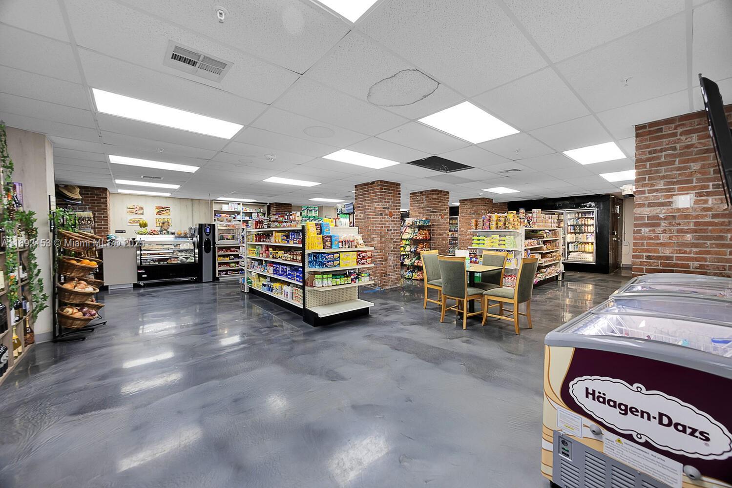 6039 Collins Avenue, Unit 311 Miami Beach, FL 33140 - Photo 21 of 26 a view of a room with gym equipment