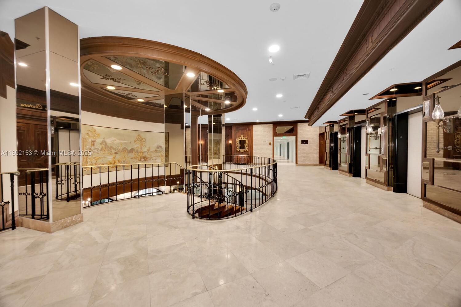 6039 Collins Avenue, Unit 311 Miami Beach, FL 33140 - Photo 23 of 26 a view of a room with gym equipment