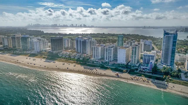a view of a brick house with a yard
