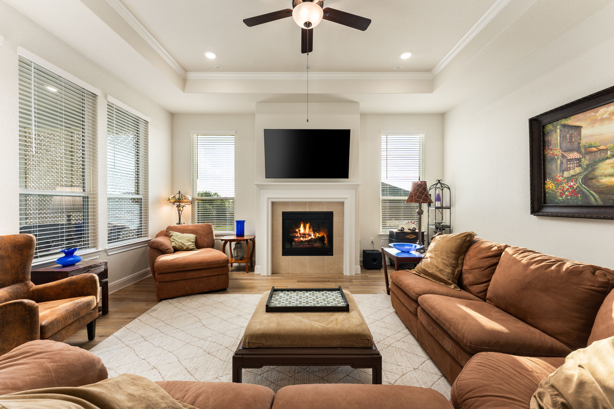 112 Telegraph Lane Georgetown, TX 78633 - Photo 10 of 35 This view of the living room shows off the tray ceiling and fireplace.