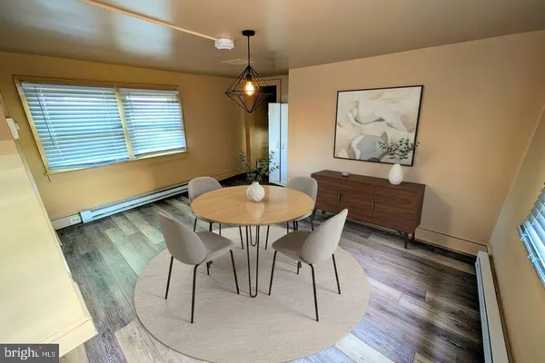 a dining room with furniture and window