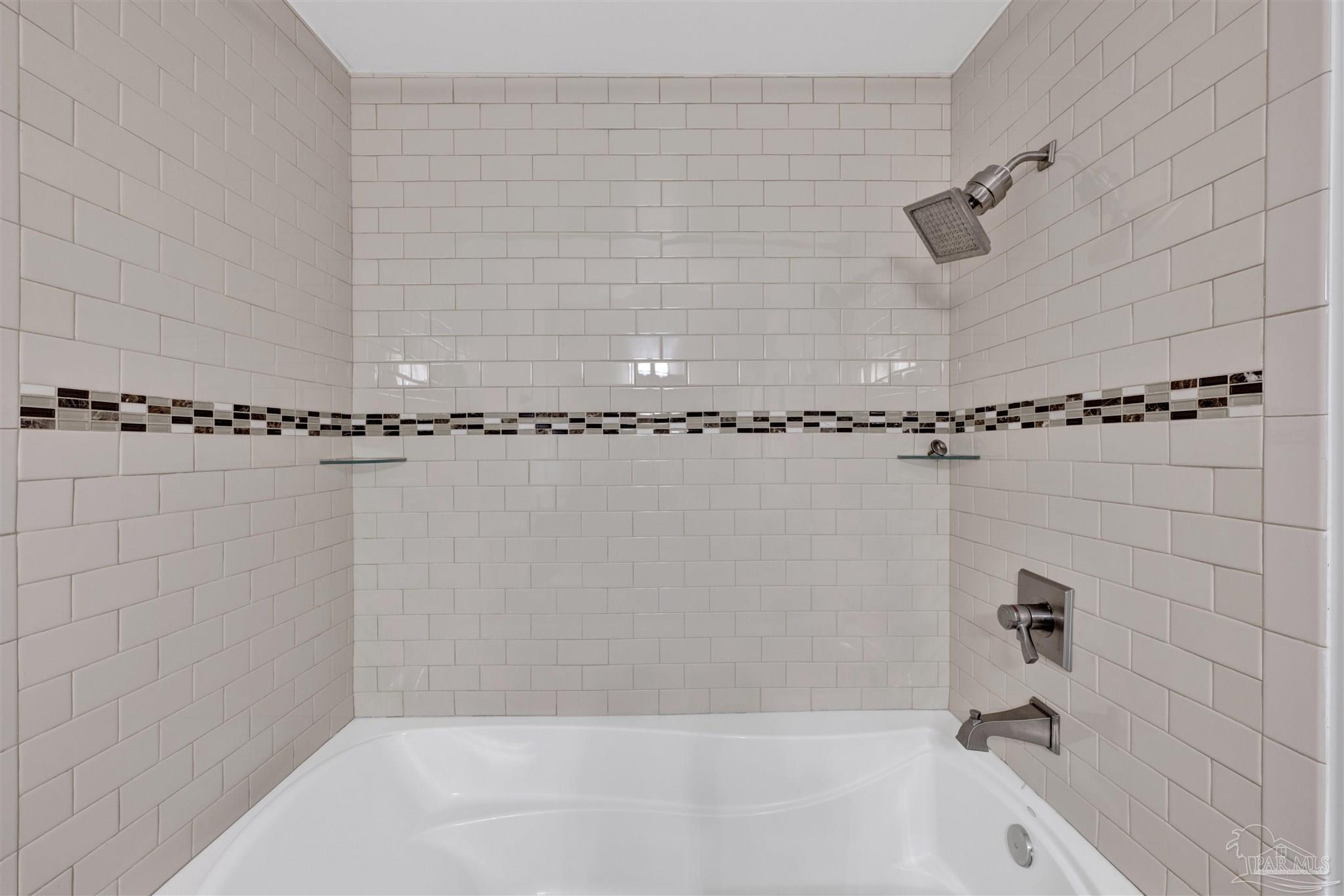 14100 River Road, Unit 334 Perdido Key, FL 32507 - Photo 22 of 35 a bathroom with a shower and a bathtub