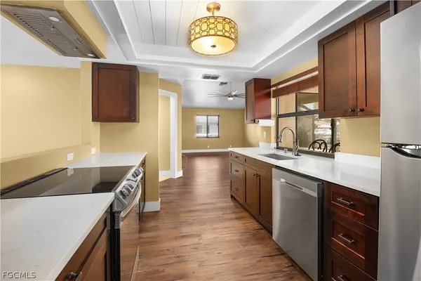 a kitchen with stainless steel appliances a stove and a refrigerator