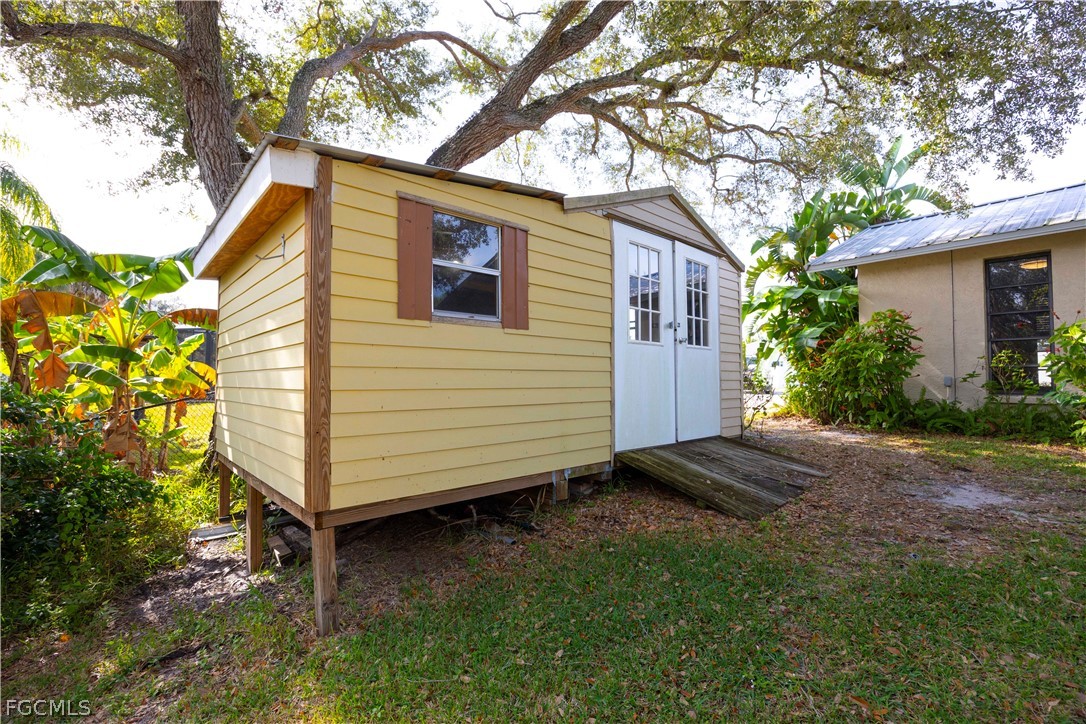 13520 Island Road Fort Myers, FL 33905 - Photo 27 of 36 a view of a house with a yard
