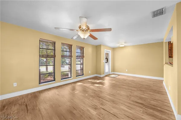 a view of an empty room with a window