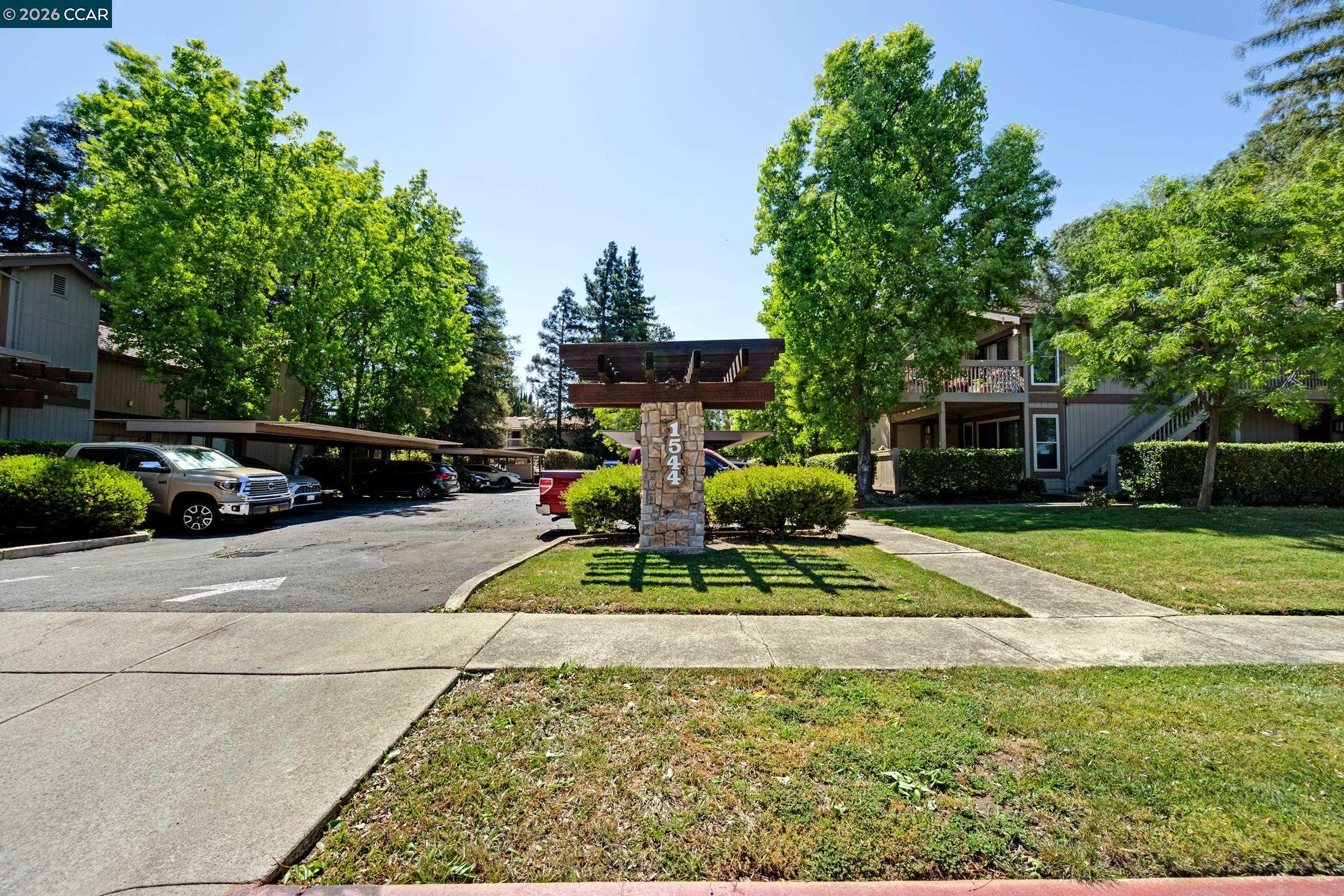 1544 Bailey Road, Unit 30 Concord, CA 94521 - Photo 32 of 33 a view of a backyard with sitting area