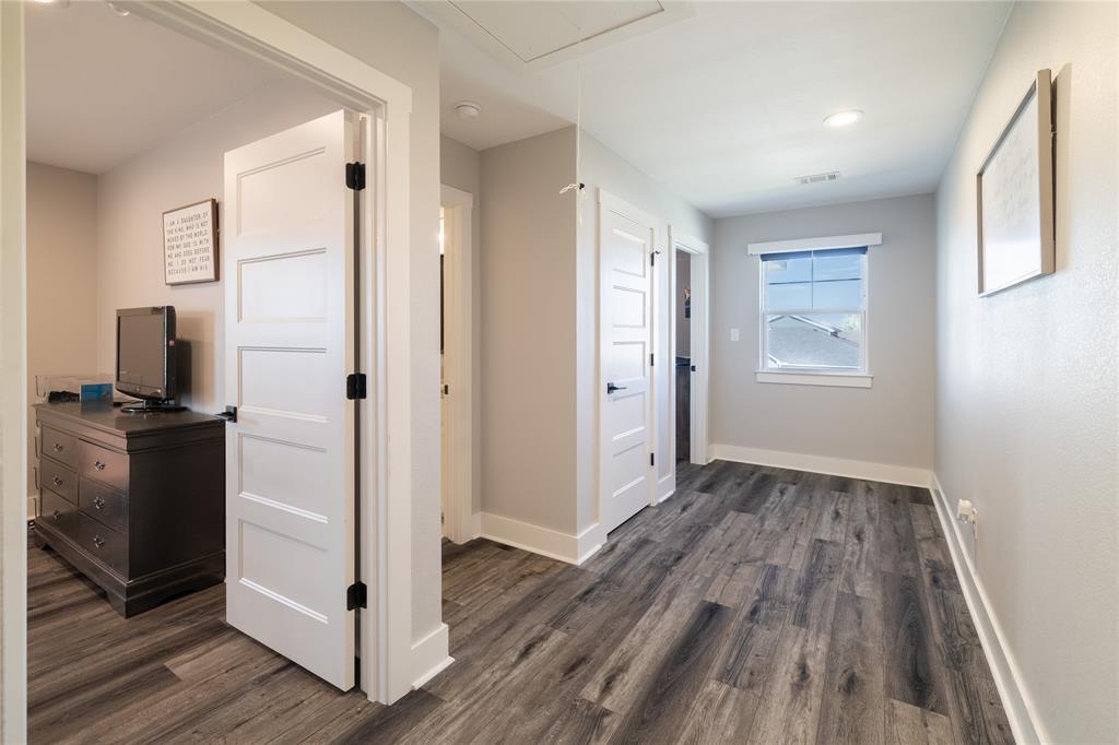 4721 Dry Creek Road Sherman, TX 75092 - Photo 13 of 25 a view of a livingroom with wooden floor and a bathroom
