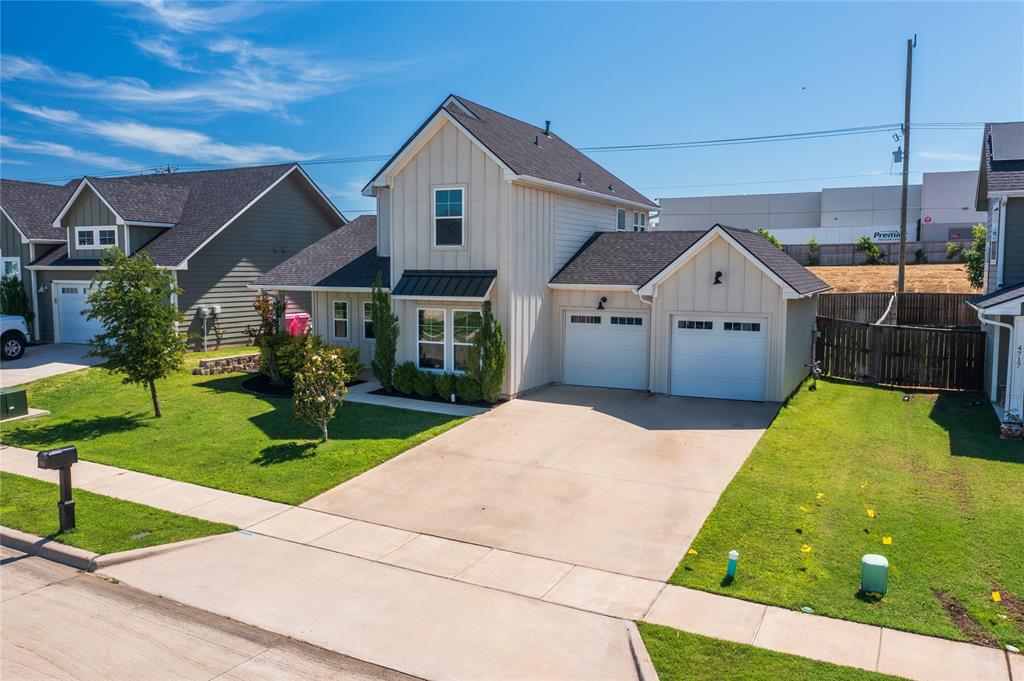 4721 Dry Creek Road Sherman, TX 75092 - Photo 23 of 25 a front view of a house with garden