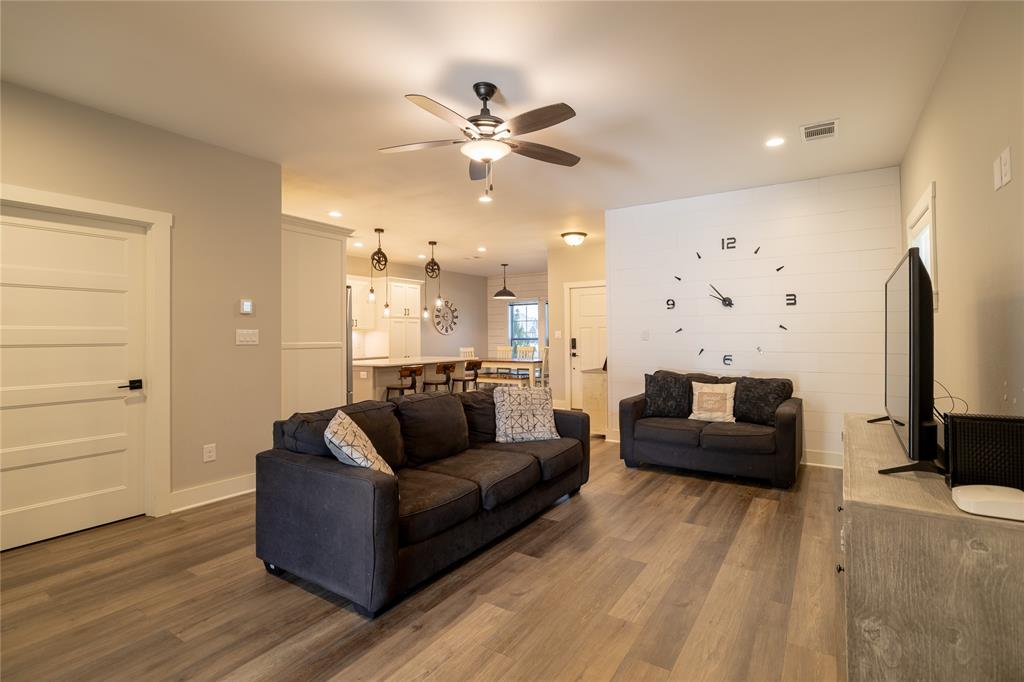 4721 Dry Creek Road Sherman, TX 75092 - Photo 5 of 25 a living room with furniture and a chandelier