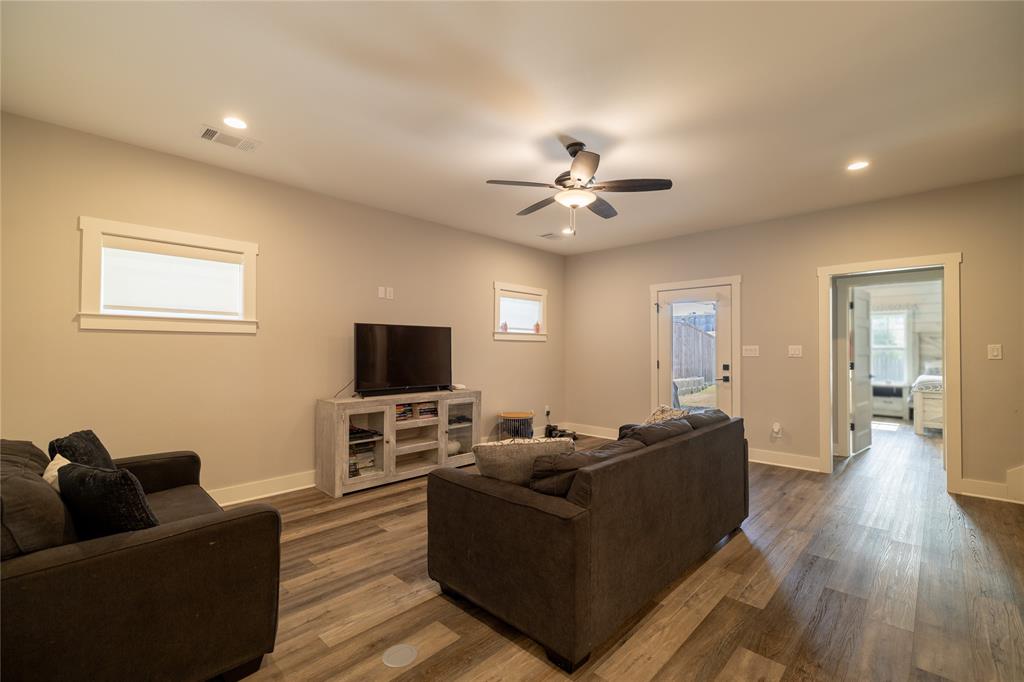 4721 Dry Creek Road Sherman, TX 75092 - Photo 6 of 25 a living room with furniture and a flat screen tv