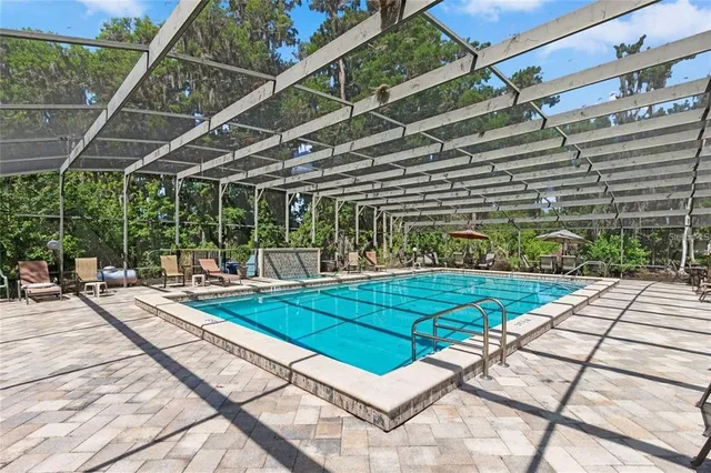a view of a swimming pool with a patio