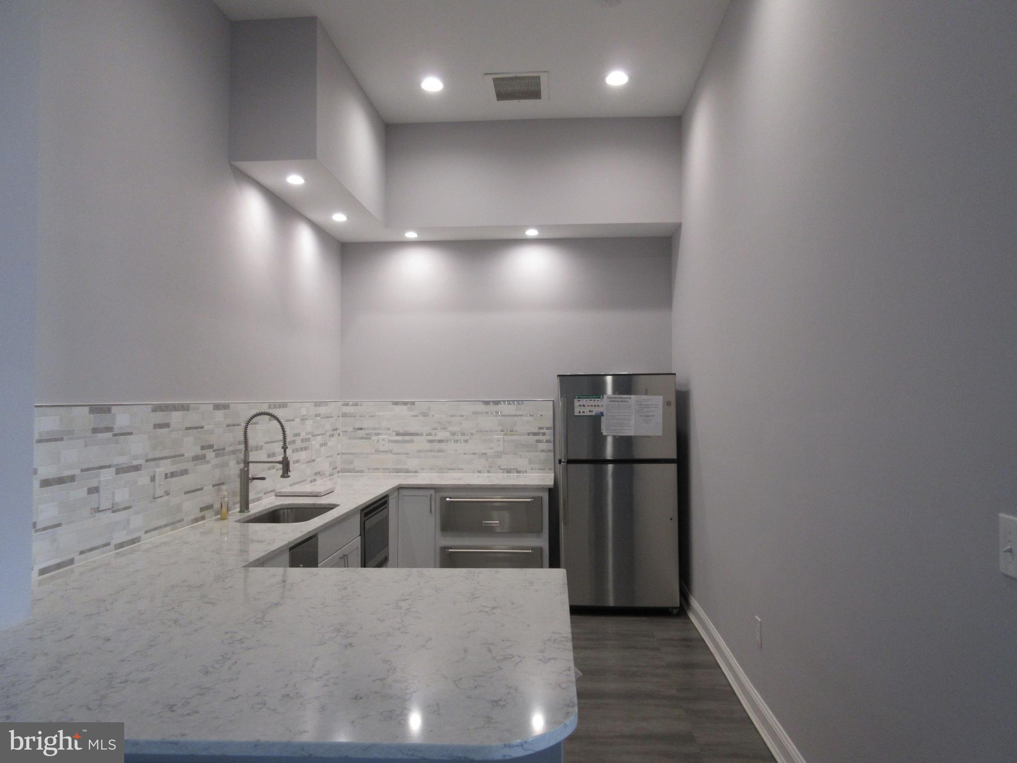 28 Inkberry Circle Gaithersburg, MD 20877 - Photo 27 of 31 Community center kitchen galley for events