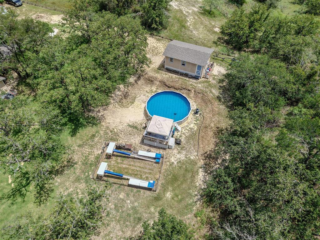 309 Tejas Trail Springtown, TX 76082 - Photo 34 of 40 Workshop-NEW ROOF, NEW POOL, Rabbit Hutches