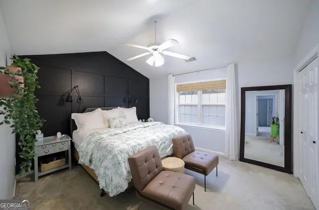 a bedroom with bed and window