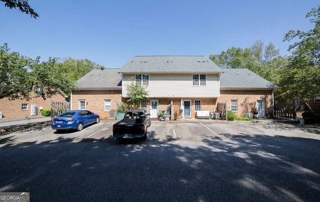 a view of a car park in front of house