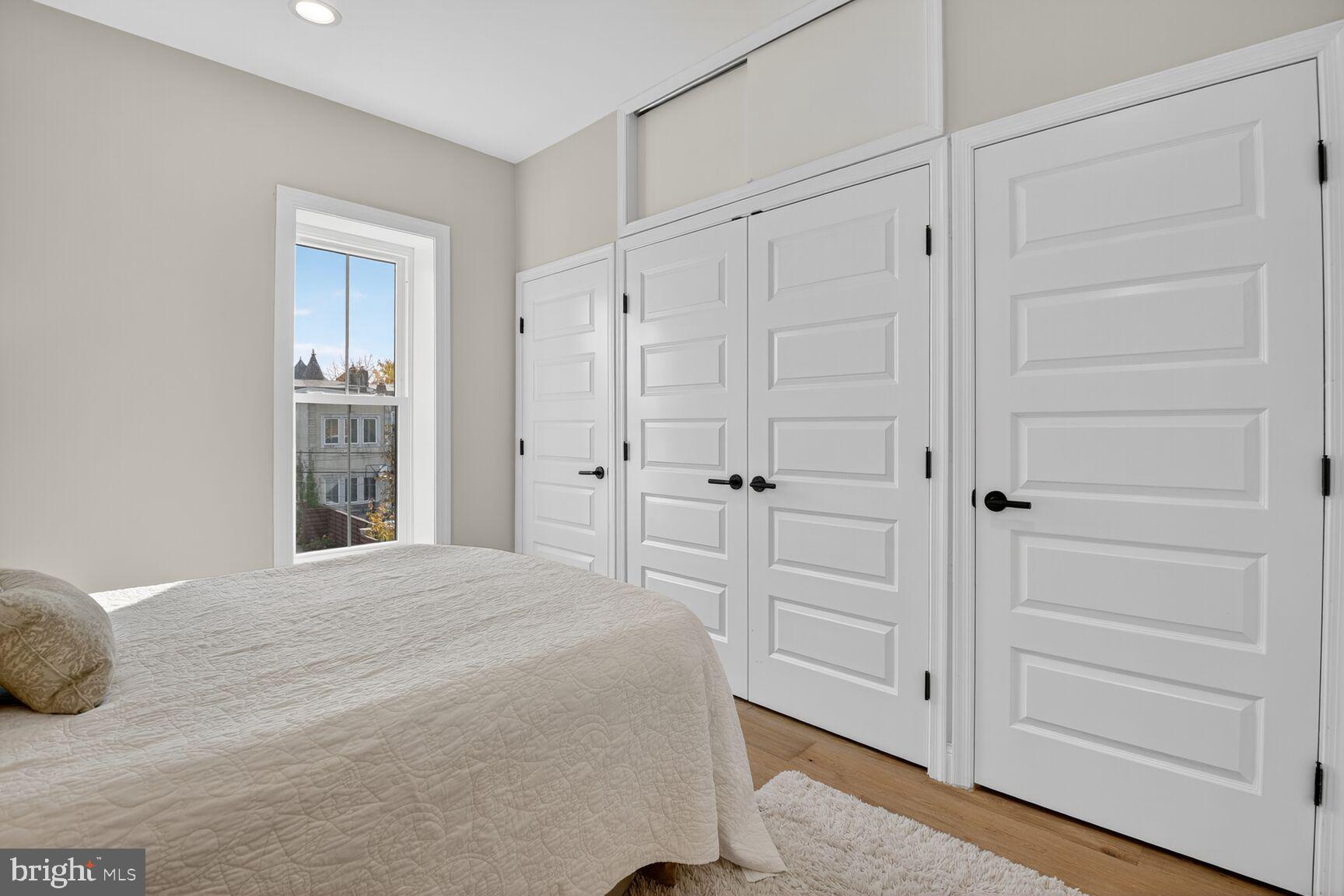 316 U Street Northwest Washington, DC 20001 - Photo 15 of 37 a bedroom with a bed and a window