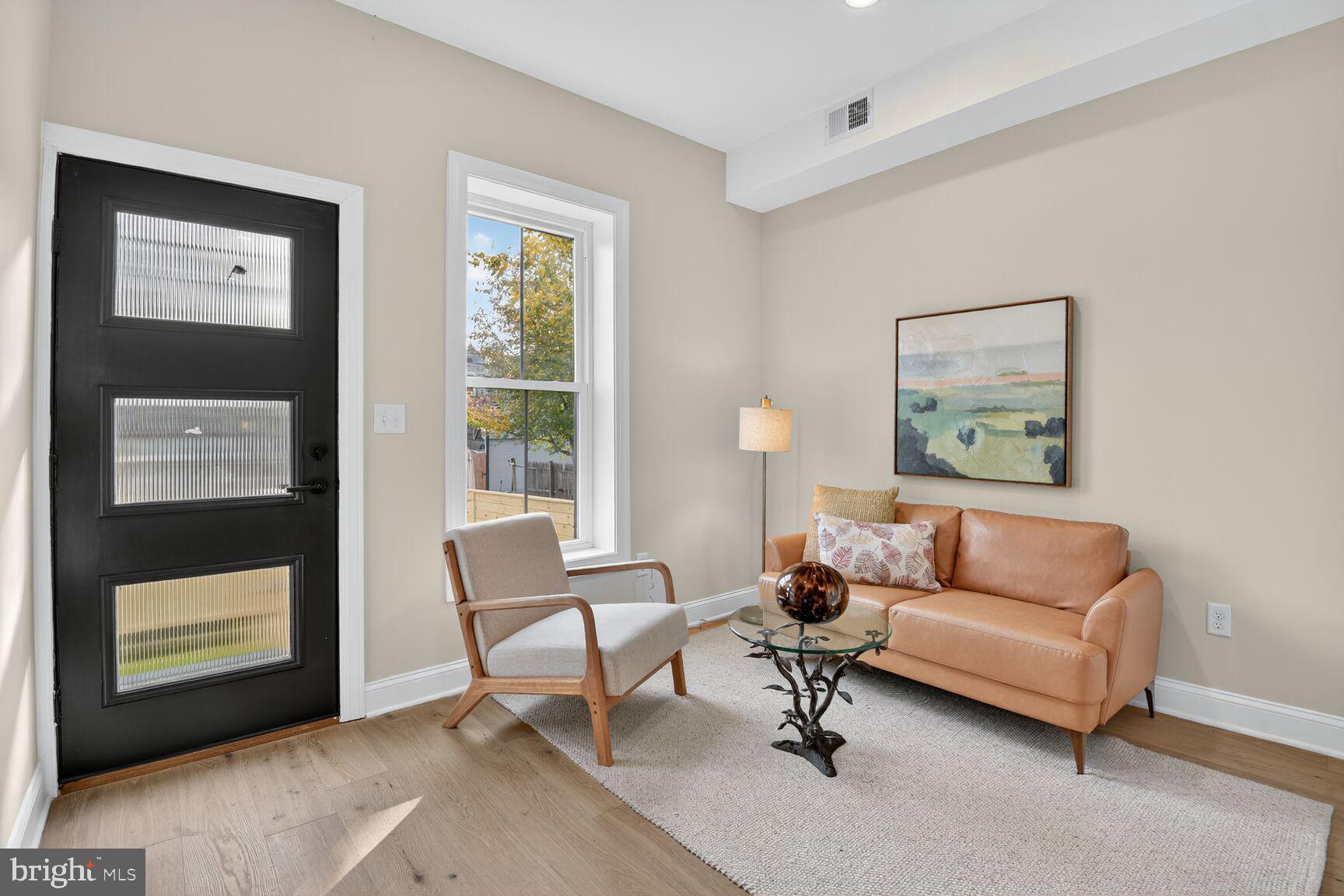 316 U Street Northwest Washington, DC 20001 - Photo 19 of 37 a living room with furniture and a window