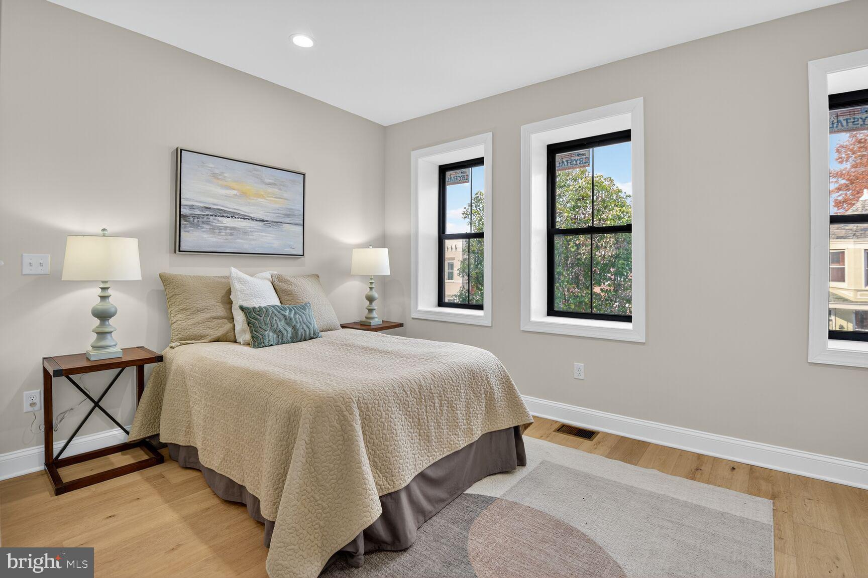 316 U Street Northwest Washington, DC 20001 - Photo 21 of 37 a bedroom with a bed and window