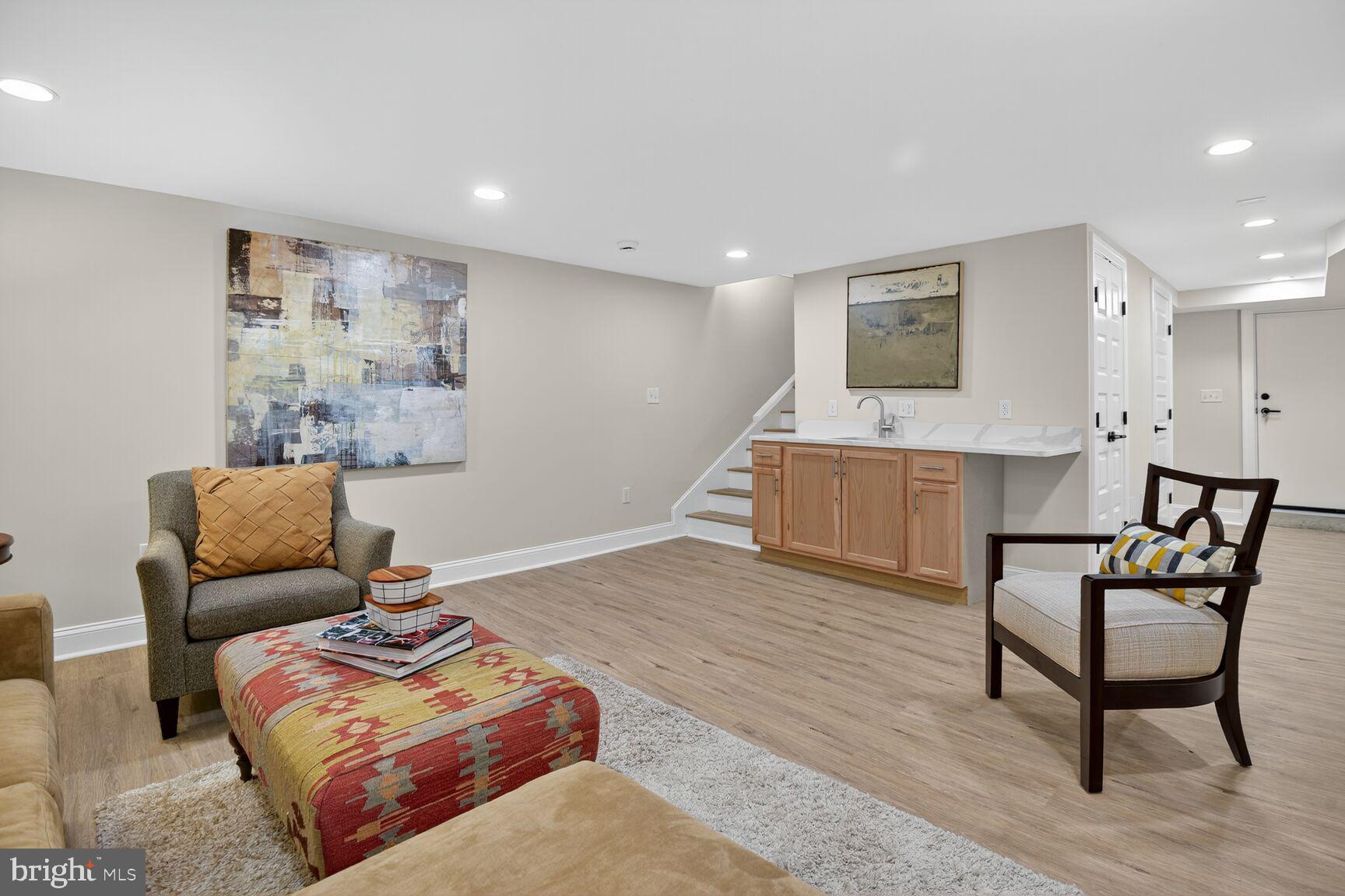 316 U Street Northwest Washington, DC 20001 - Photo 27 of 37 a living room with furniture and a wooden floor