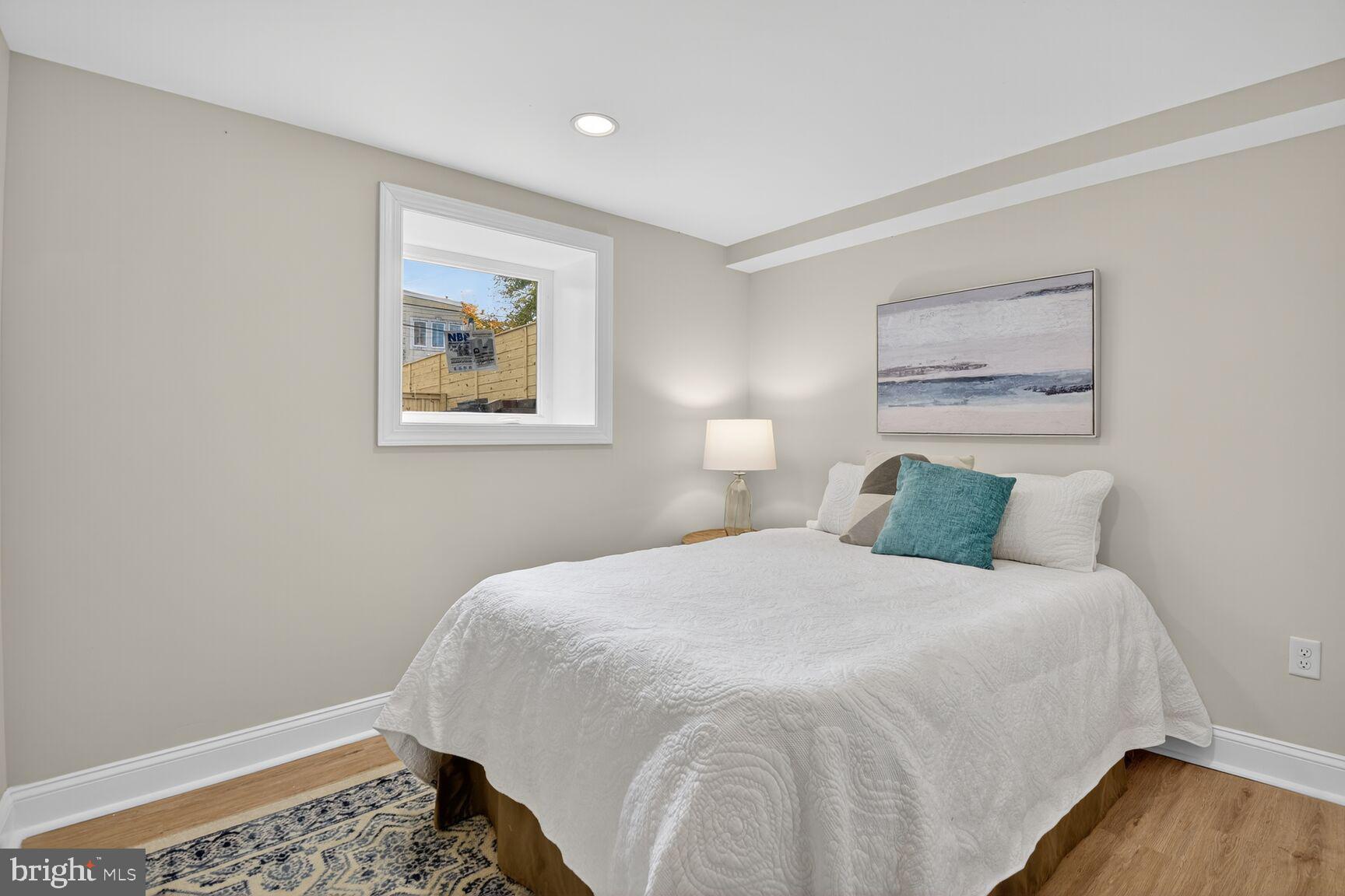 316 U Street Northwest Washington, DC 20001 - Photo 29 of 37 a bedroom with a bed and a wall painting