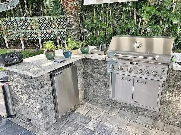 a kitchen with a sink and a stove top oven