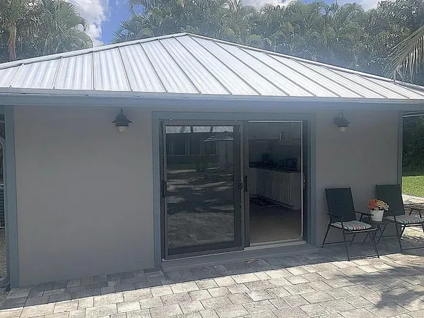 a view of a backyard of the house