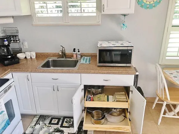 a living room with furniture rug and window