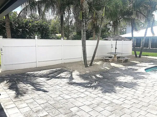 a bedroom with a bed and a mirror