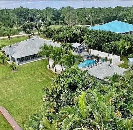 a view of a house with a backyard