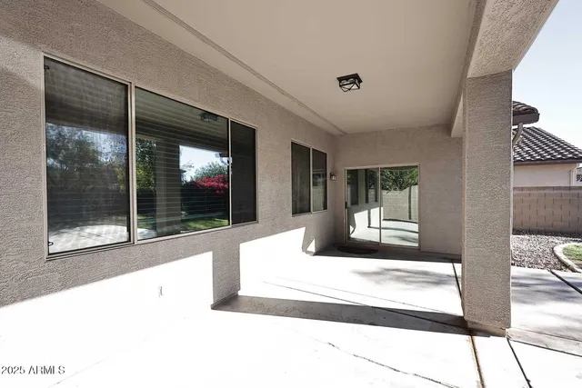 a living room with a large window and front door