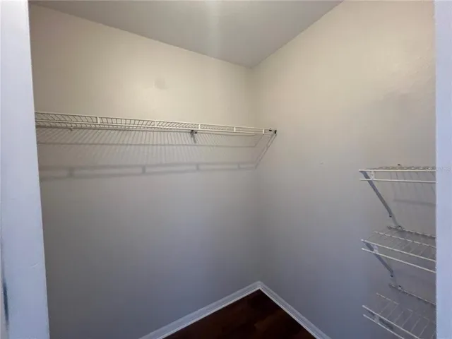 a view of hallway with wooden floor