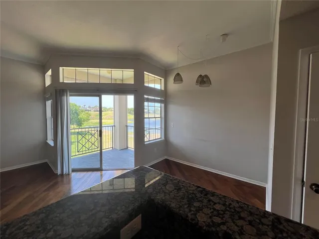 a view of a livingroom with wooden floor
