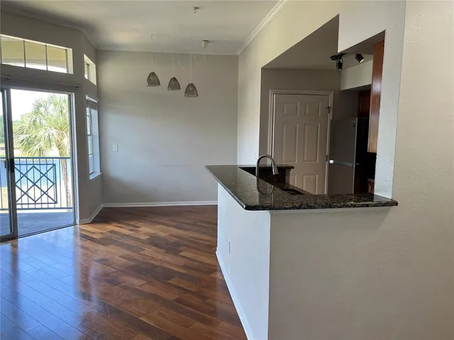 a kitchen with a refrigerator and a microwave
