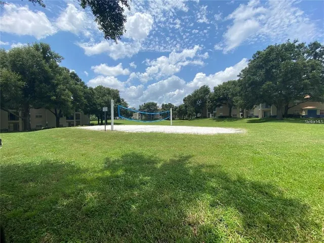 a swimming pool with outdoor seating and yard