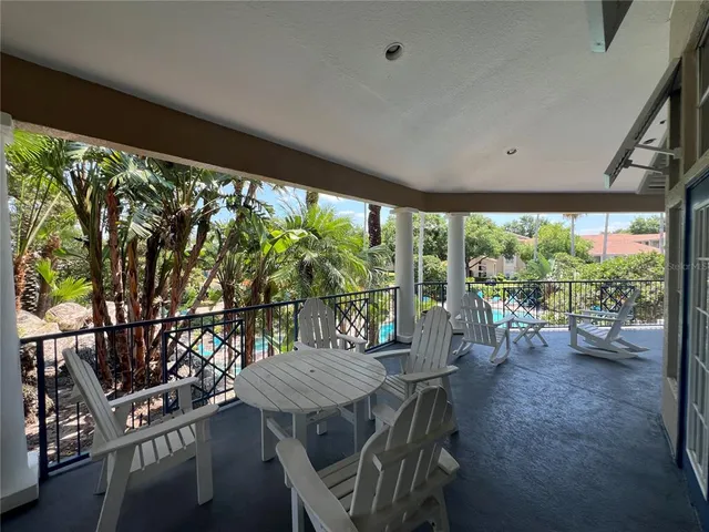 a living room with furniture fireplace and flat screen tv