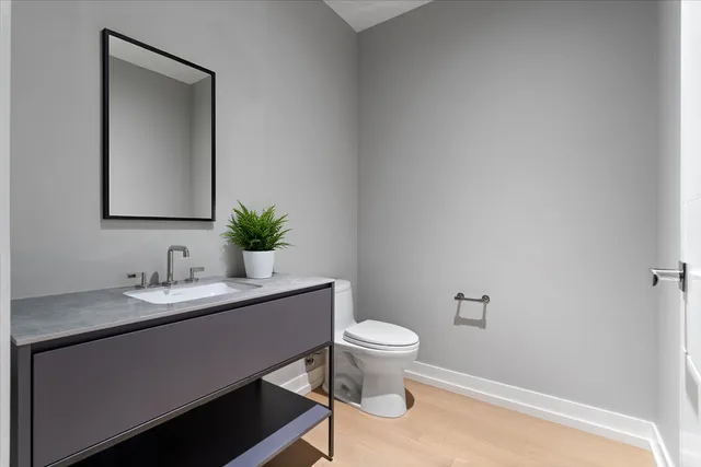 a bedroom with furniture and a large window